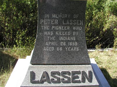 A monument that reads "In memory of Peter Lassen. The pioneer who was killed by the Indians. April 26 1859. Aged 66 years